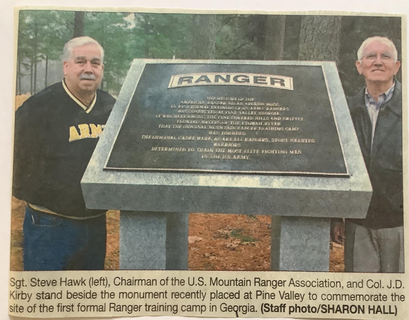Sgt. Steve Hawk and Col. J.D. Kirby beside the Ranger monument at Pine Valley